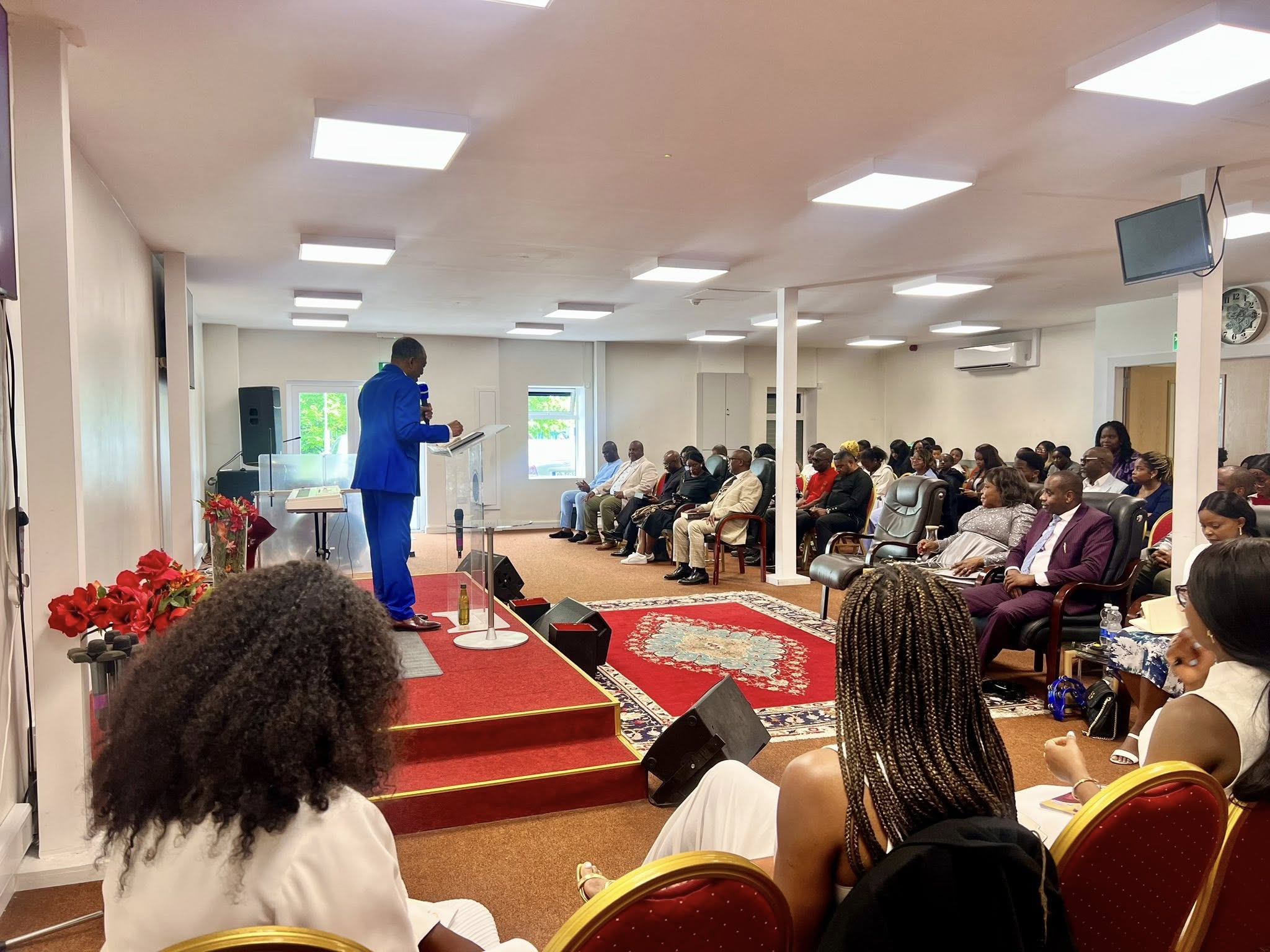Lead Pastor Anthony Joseph preaching to the Hope and Glory congregation