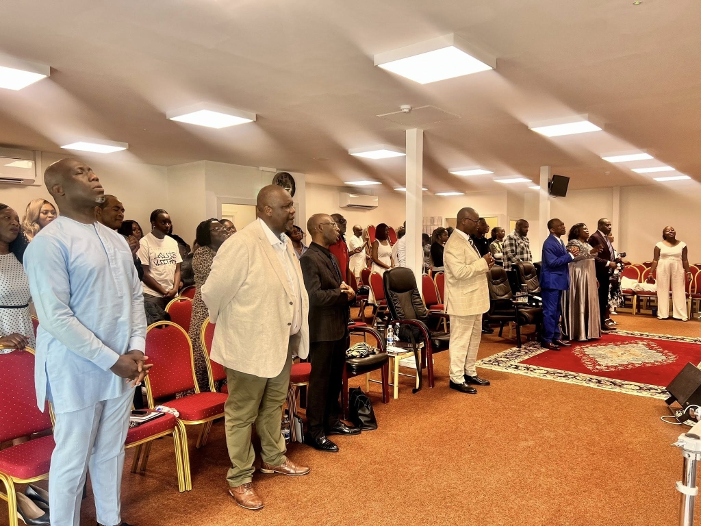 Congregation standing in worship