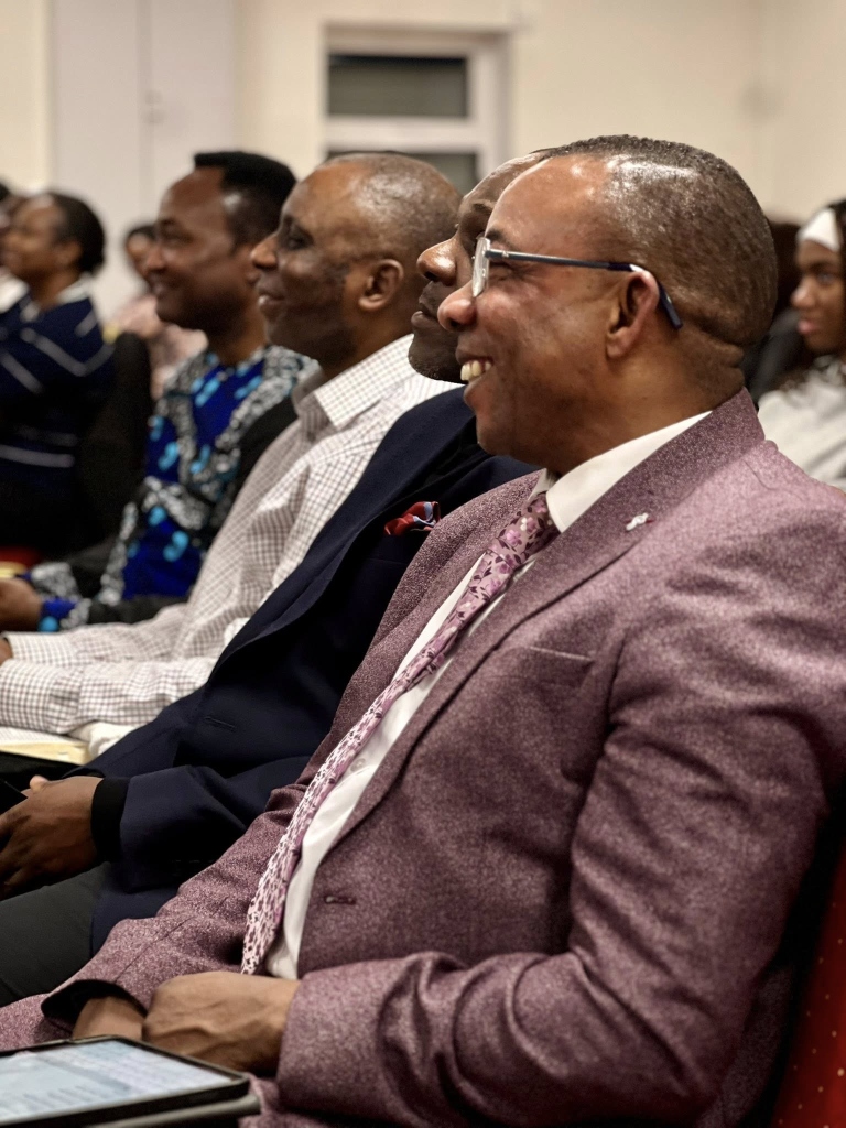 Church members smiling during a gathering